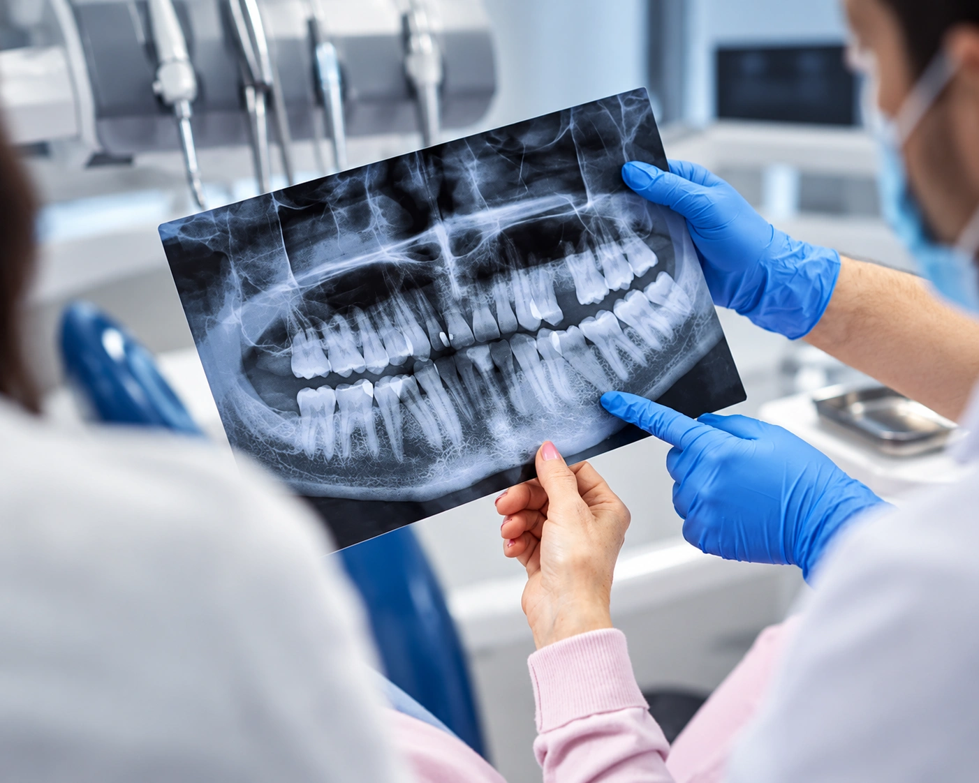 Dentist and patient reviewing panoramic dental X-ray consultation at Ilaj Dental Care